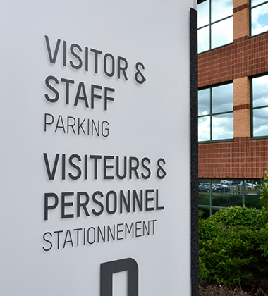 Visitors and staff parking sign