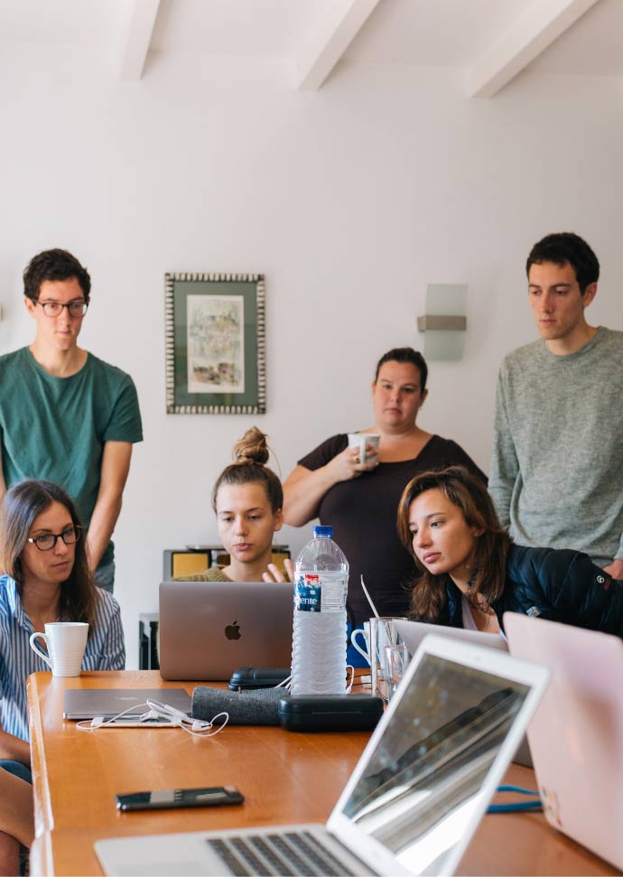 Team of young creatives working at Twilight