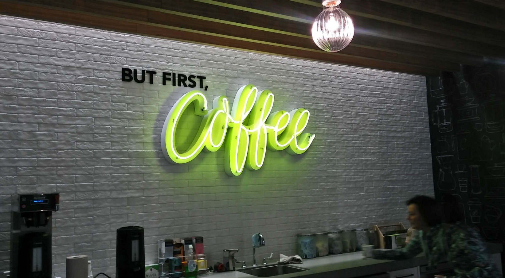 But first, Coffee logo sign on brick wall