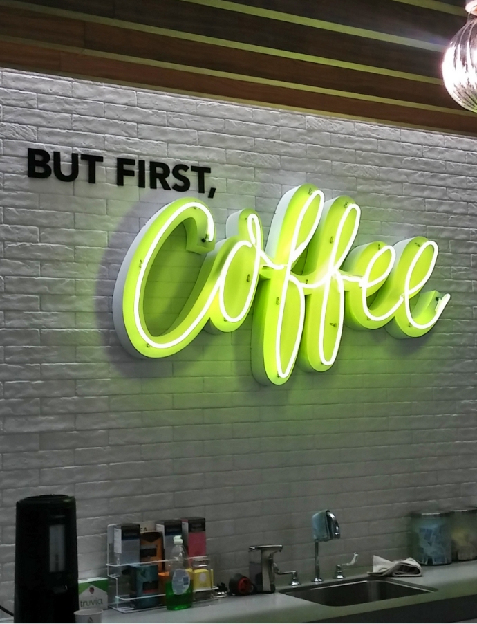 But first, Coffee logo sign on brick wall